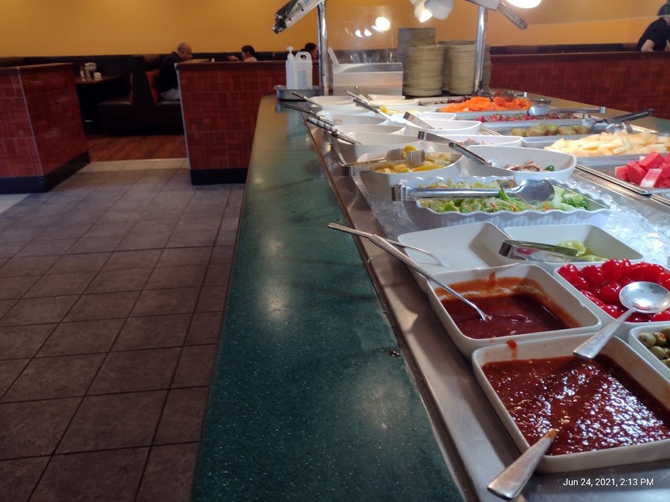 Self-serve buffet counter inside a casual restaurant.